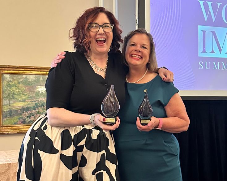 Jennifer Hawton and Mary Barber celebrating at the 2026 2026 PRSA Strategies & Tactics Women of Impact Summit & Awards.